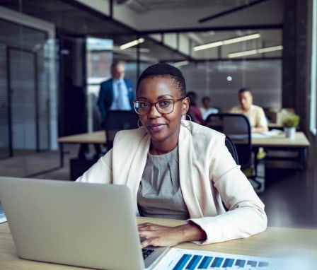 Woman on laptop in office