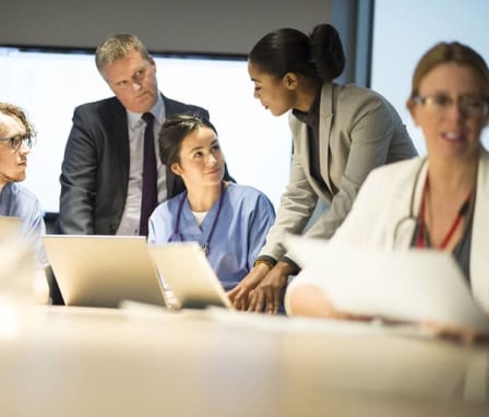 Group of healthcare colleagues talking to each other