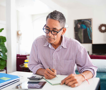 Man doing math at home office