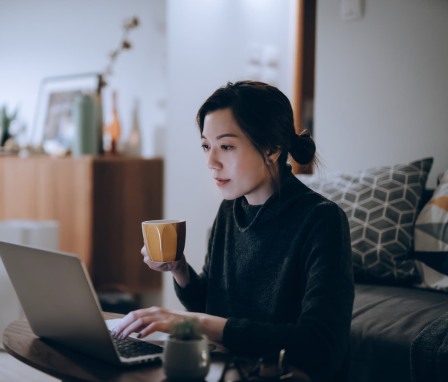 Woman working on laptop at home