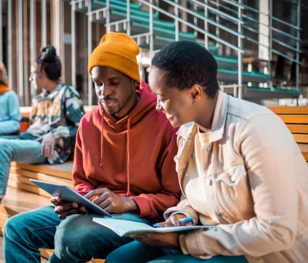 Students talking on bench