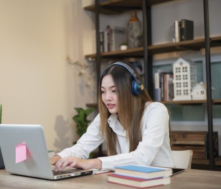 Person typing on laptop in home office