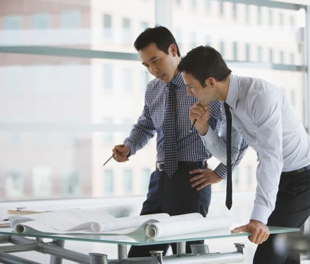 Two professional men working together in an office