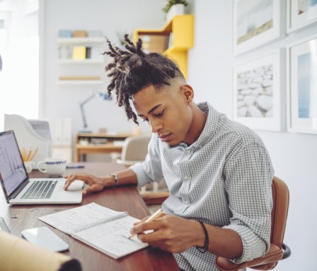 Man working at desk on laptop