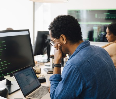 Person coding a website on a computer