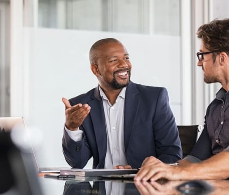 Two business men talking in an office