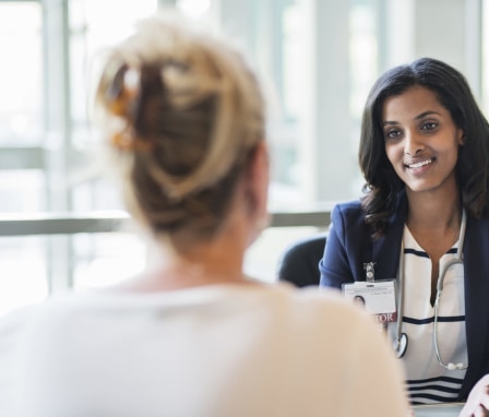 Healthcare professional talking to a patient