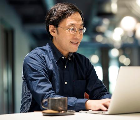 Businessman typing on laptop