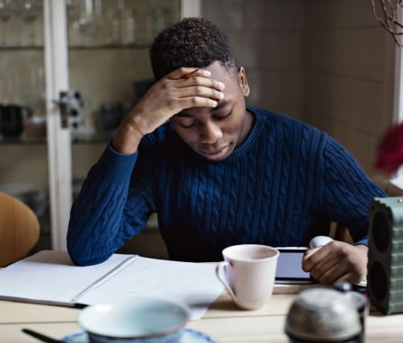 Young person studying in notebook