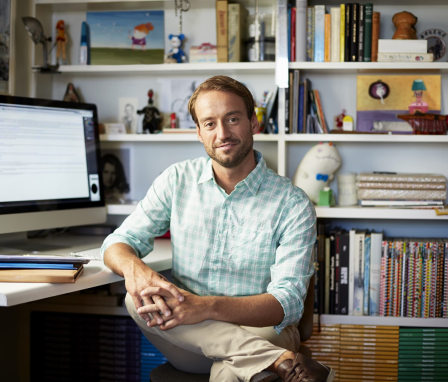 Man on computer in home office