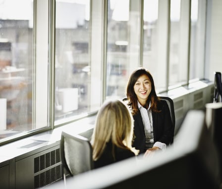 Two professional women meeting