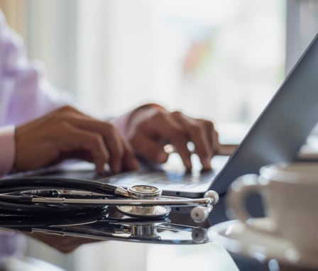 Nurse student studying on laptop