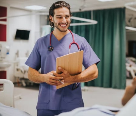 Male nurse checking on a patient