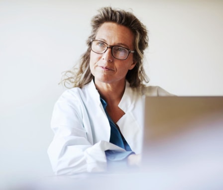 Female doctor using laptop