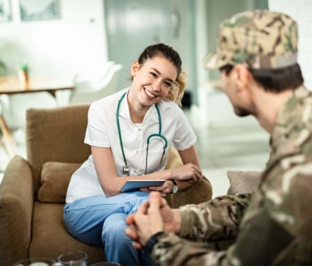 Nurse chatting with soldier patient