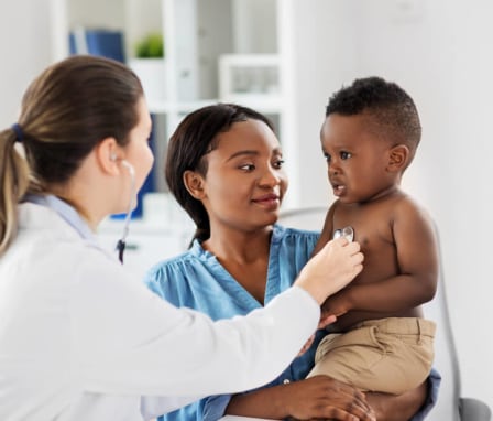 African American boy with doctor
