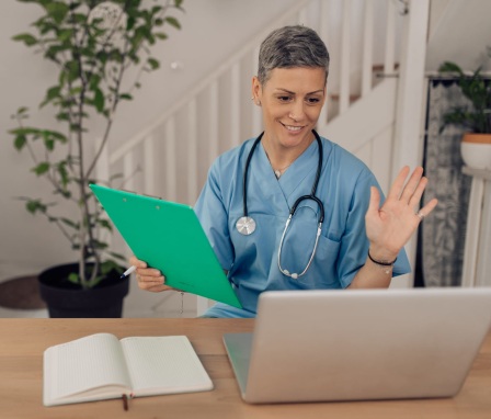 Female nurse working with her patient on their online health checkup