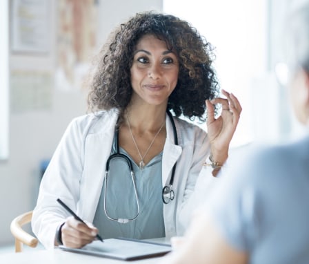 Family Nurse Practitioner talking with a patient.
