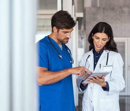 Doctor and nurse discussing medical report