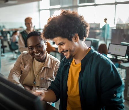 Close up of a group of students in the university working on their computers