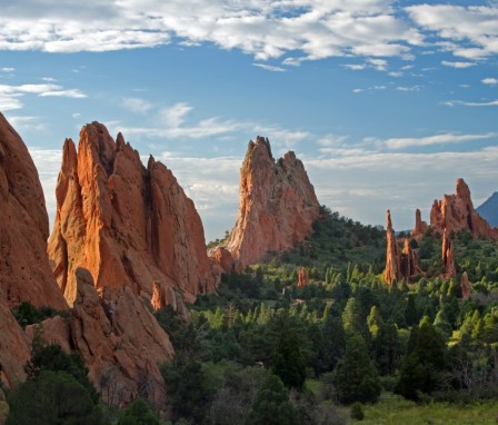 Blue skies with clouds over rock formations in Garden of the Gods in Colorado Springs, Colorado.