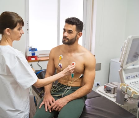 EKG technician monitoring patient