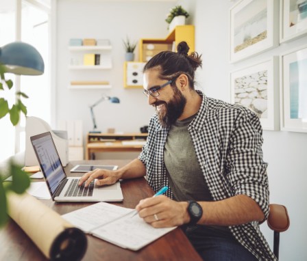 An accounting student works at home office.