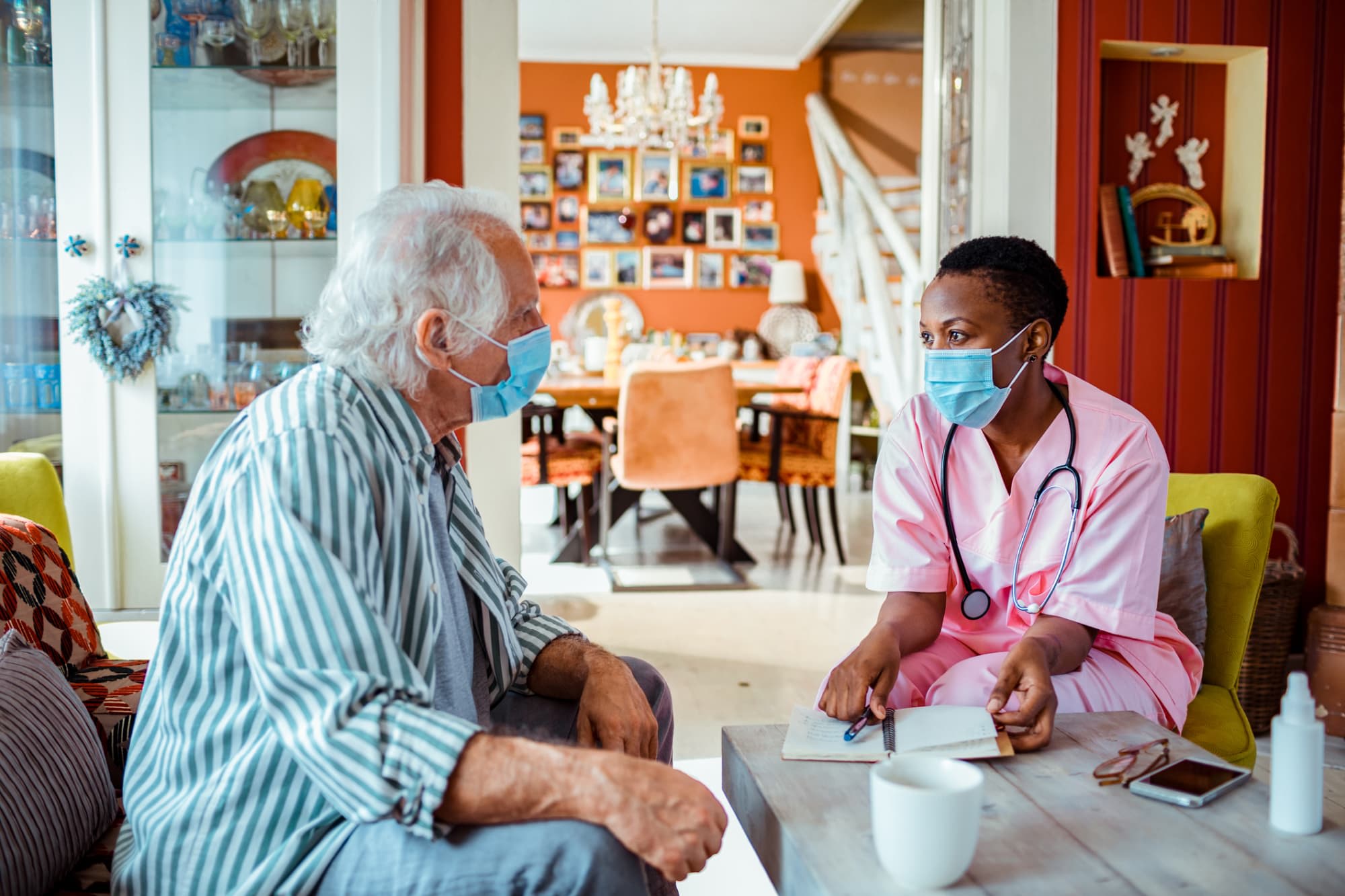 Nurse talking with senior patient