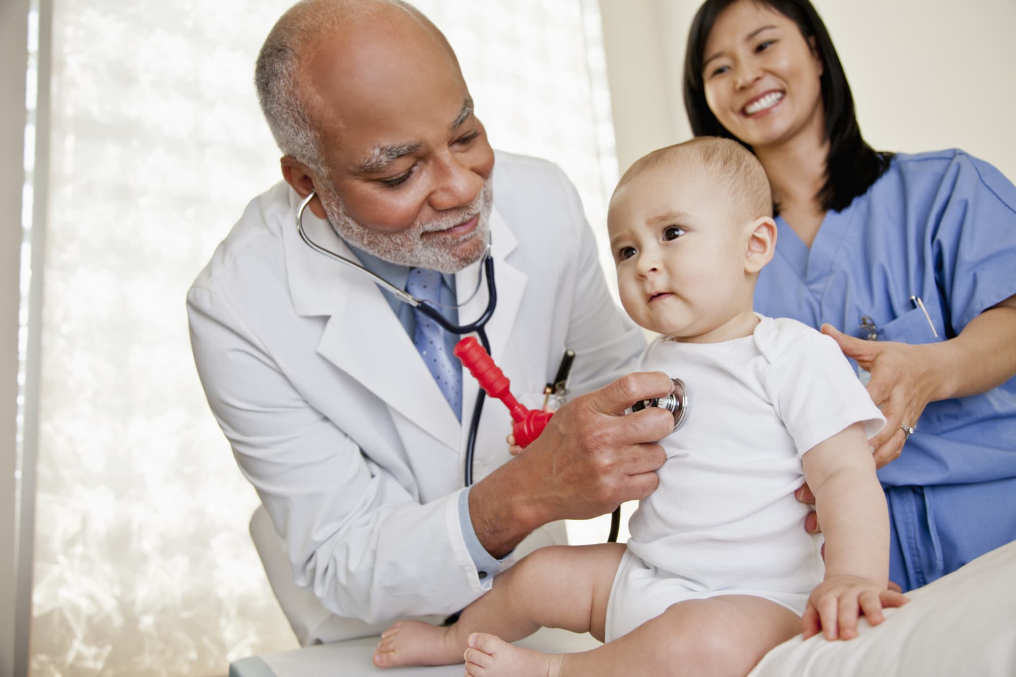 Doctor examining baby's heartbeat