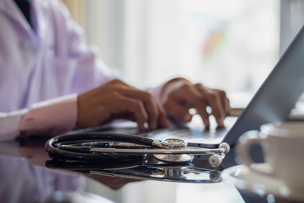 Nurse student studying on laptop