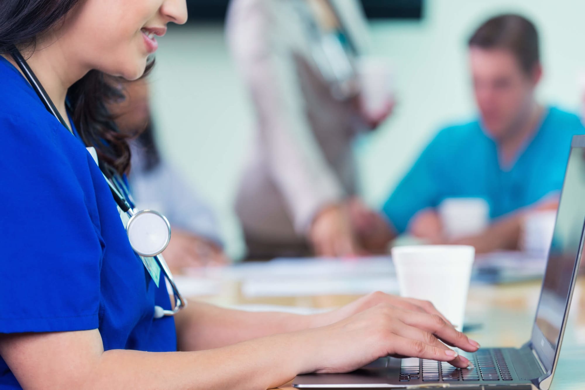 Nursing student studying on laptop