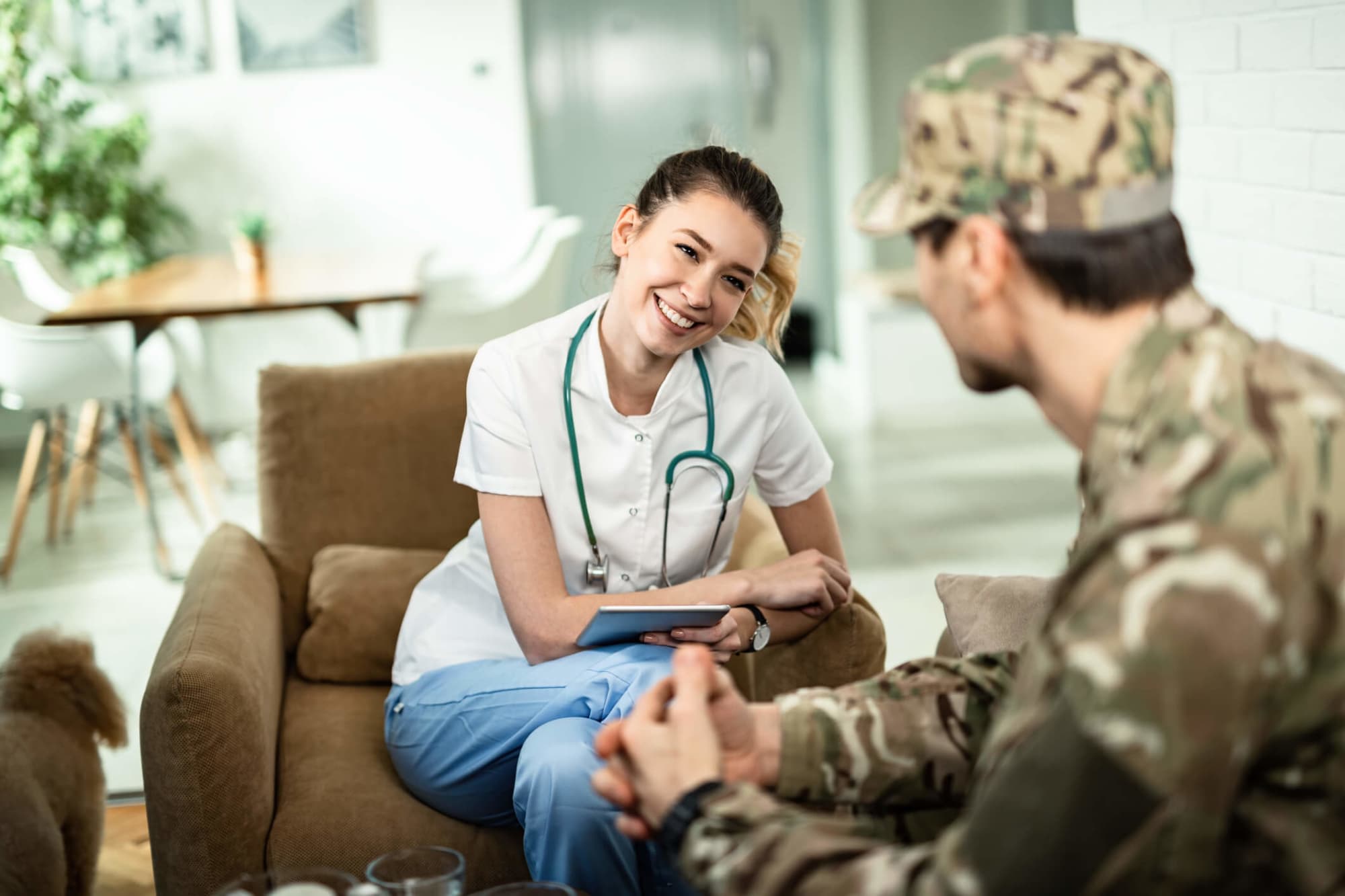 Nurse chatting with soldier patient