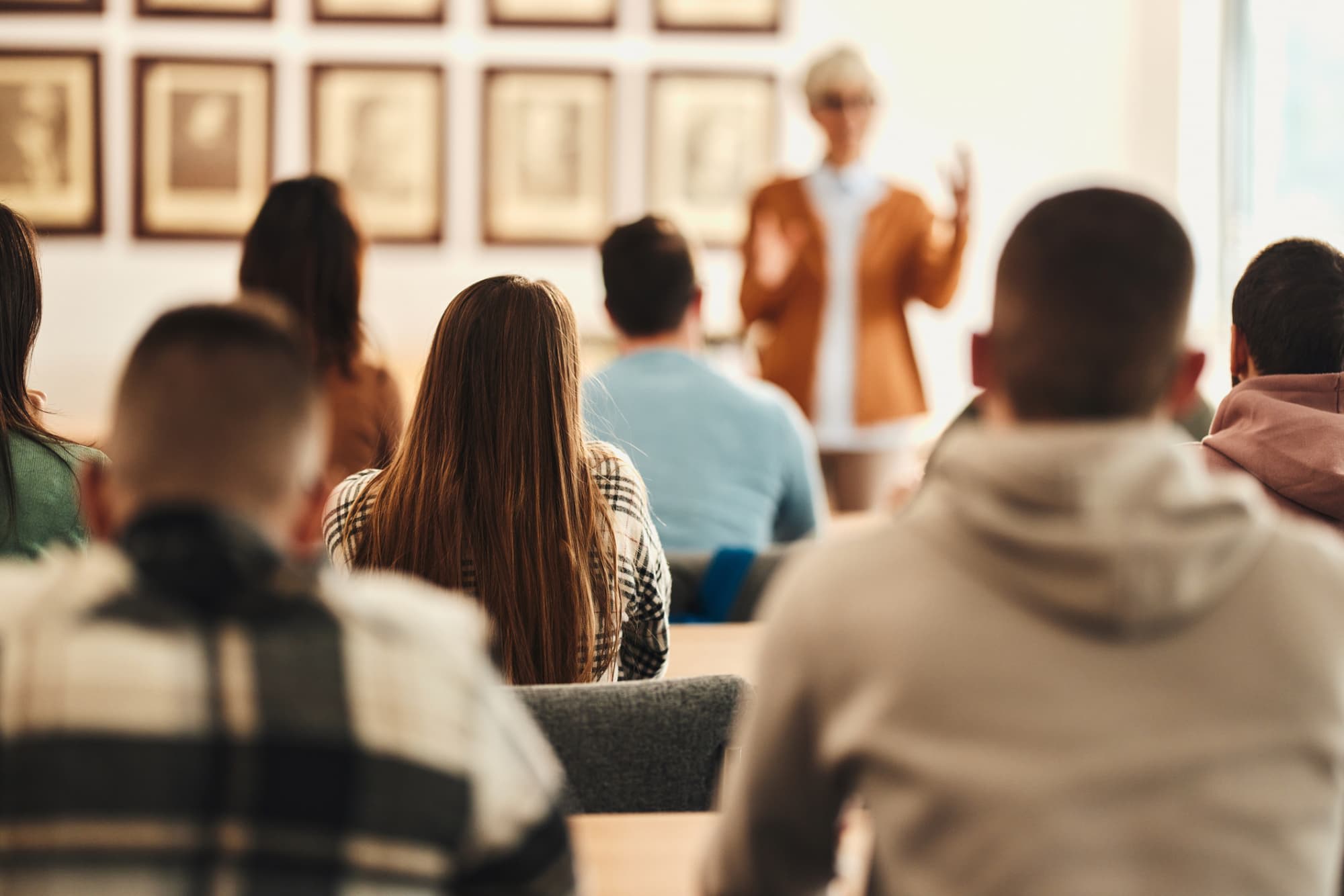 Students listening to an instructor talking