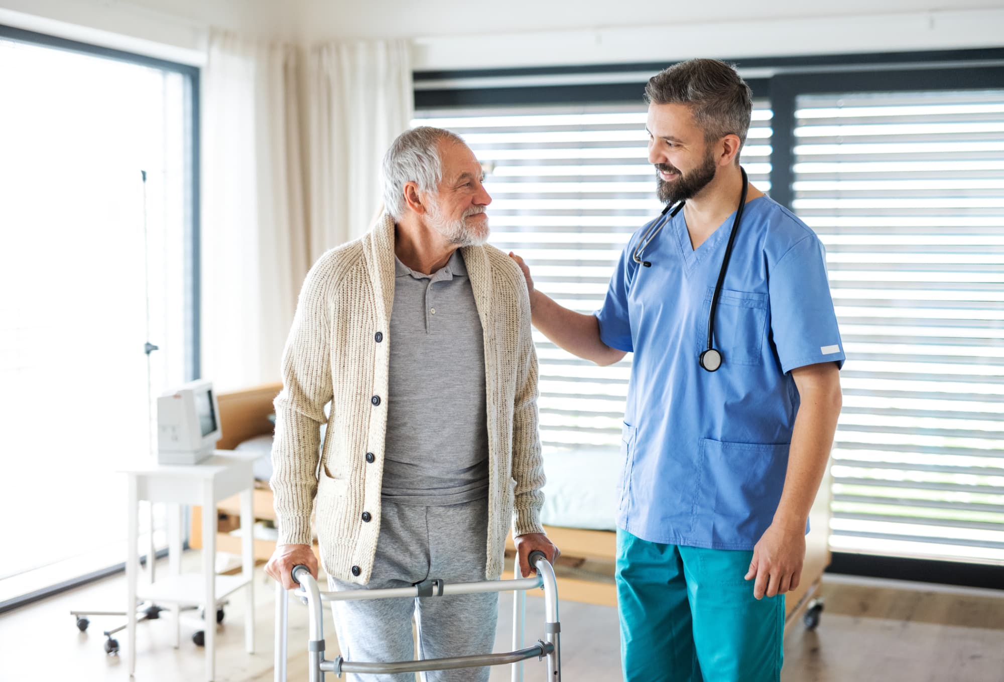 Nurse comforting older patient