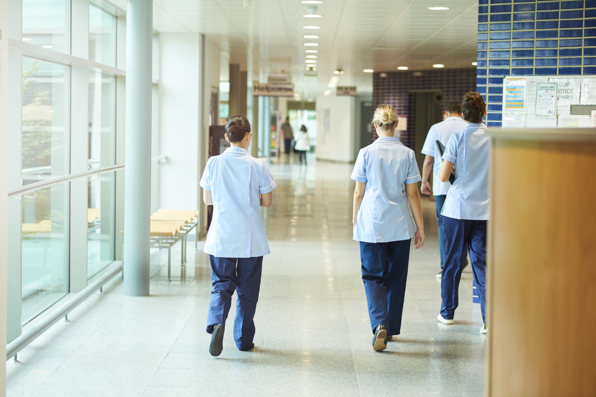 Nurses walking out of a hospital