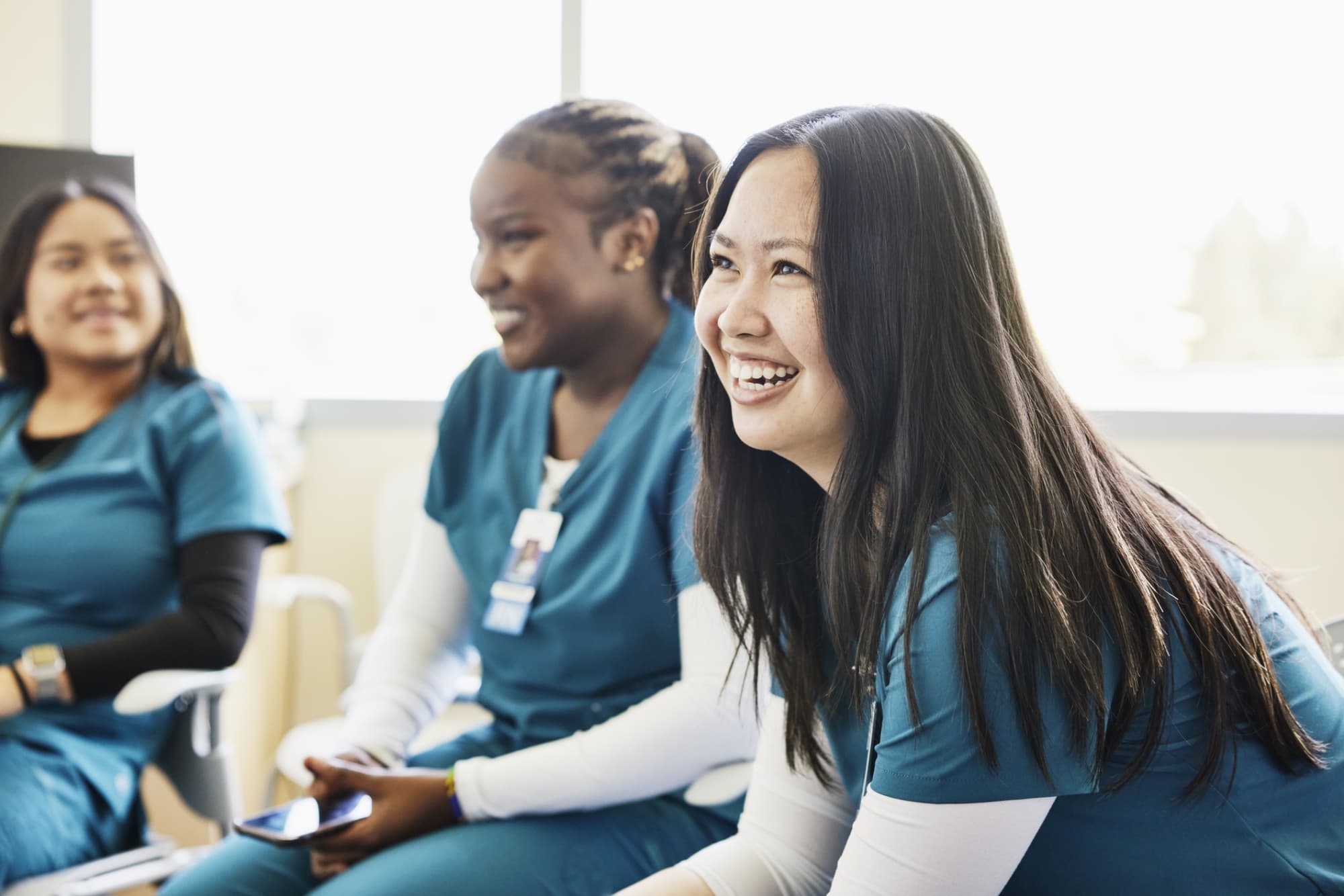 Nurses laughing and talking together