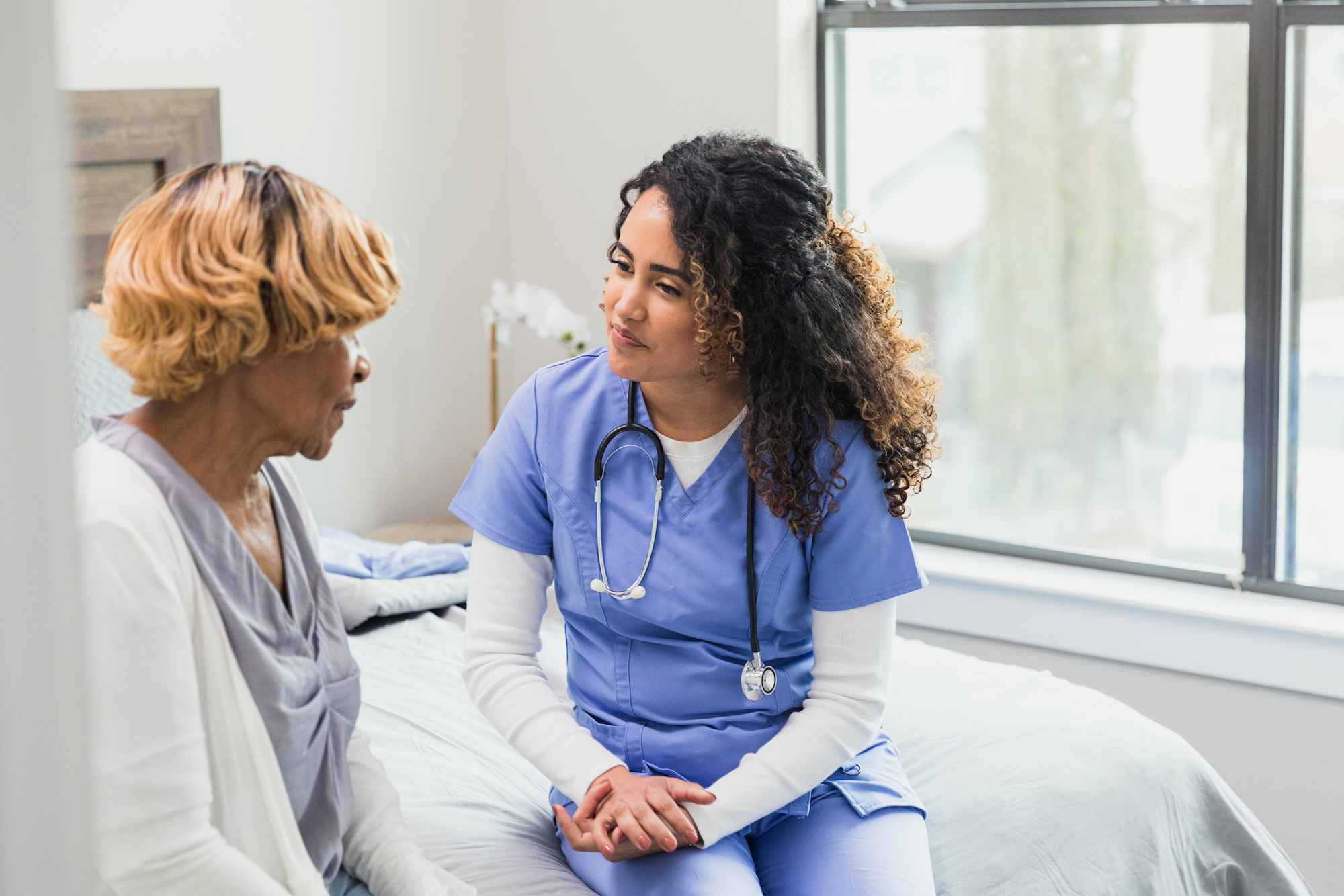 Psychiatric nurse talking to patient