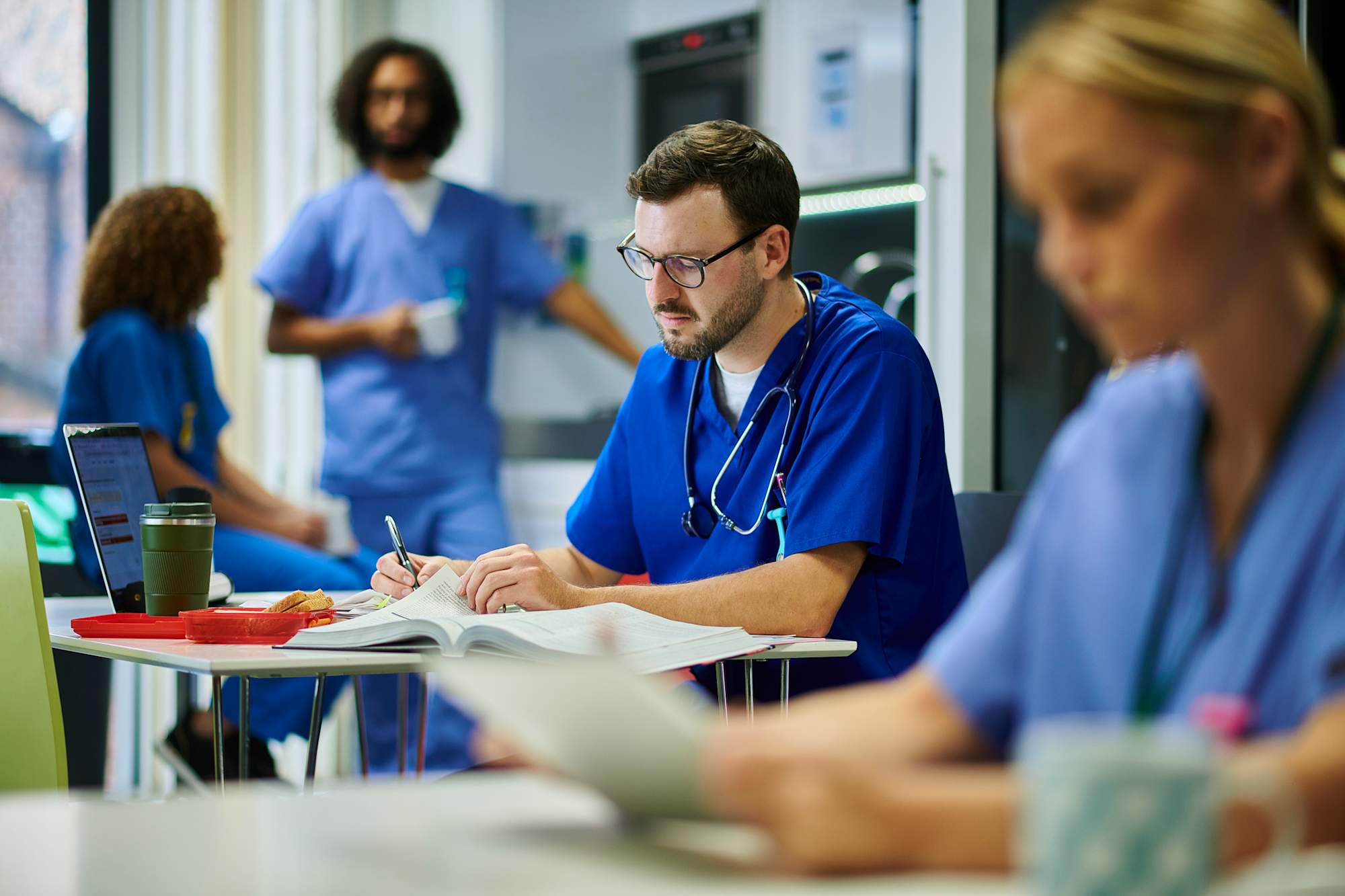 Nursing student studying in hospital breakroom