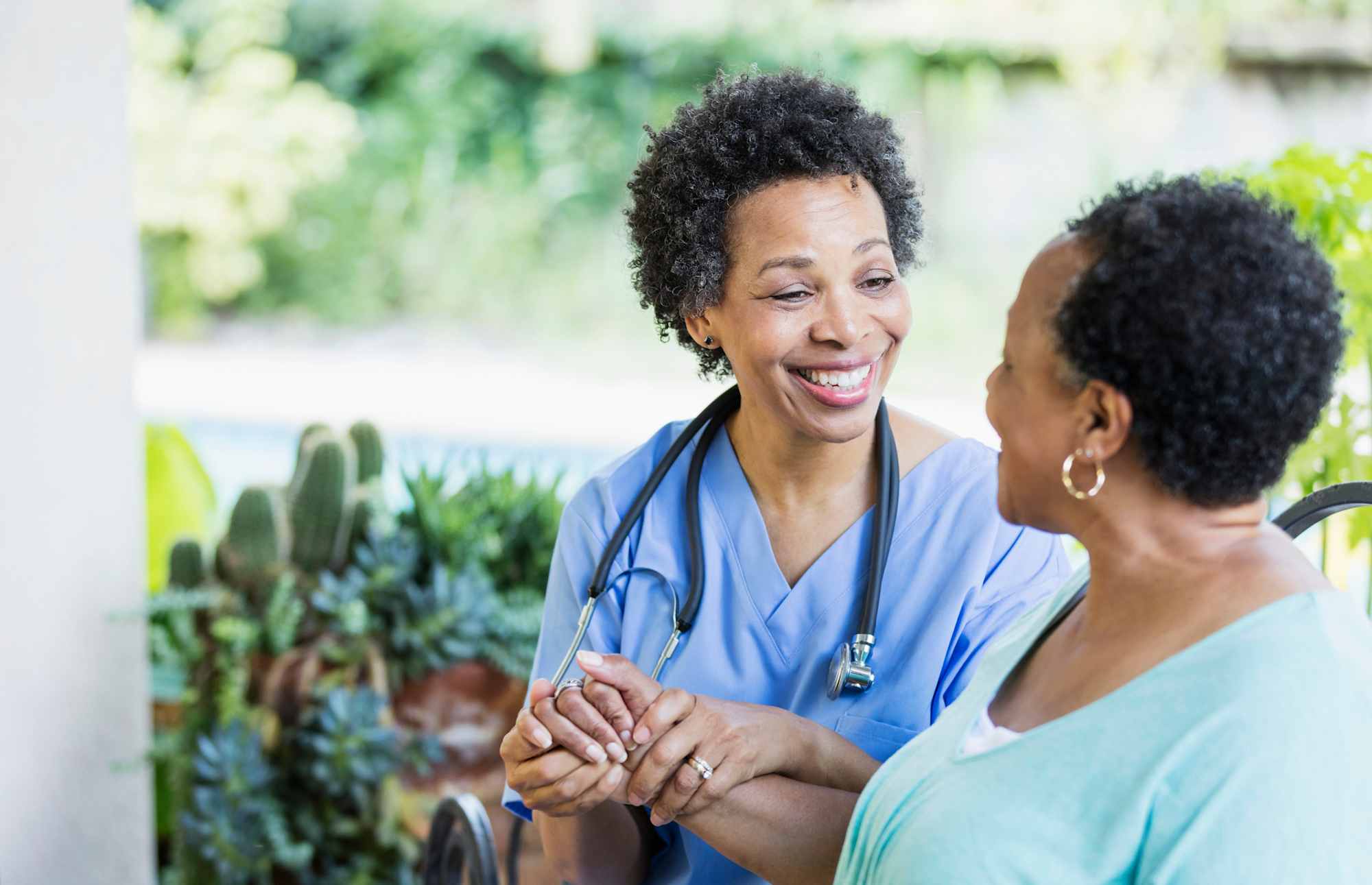 Nurse helping patient at home