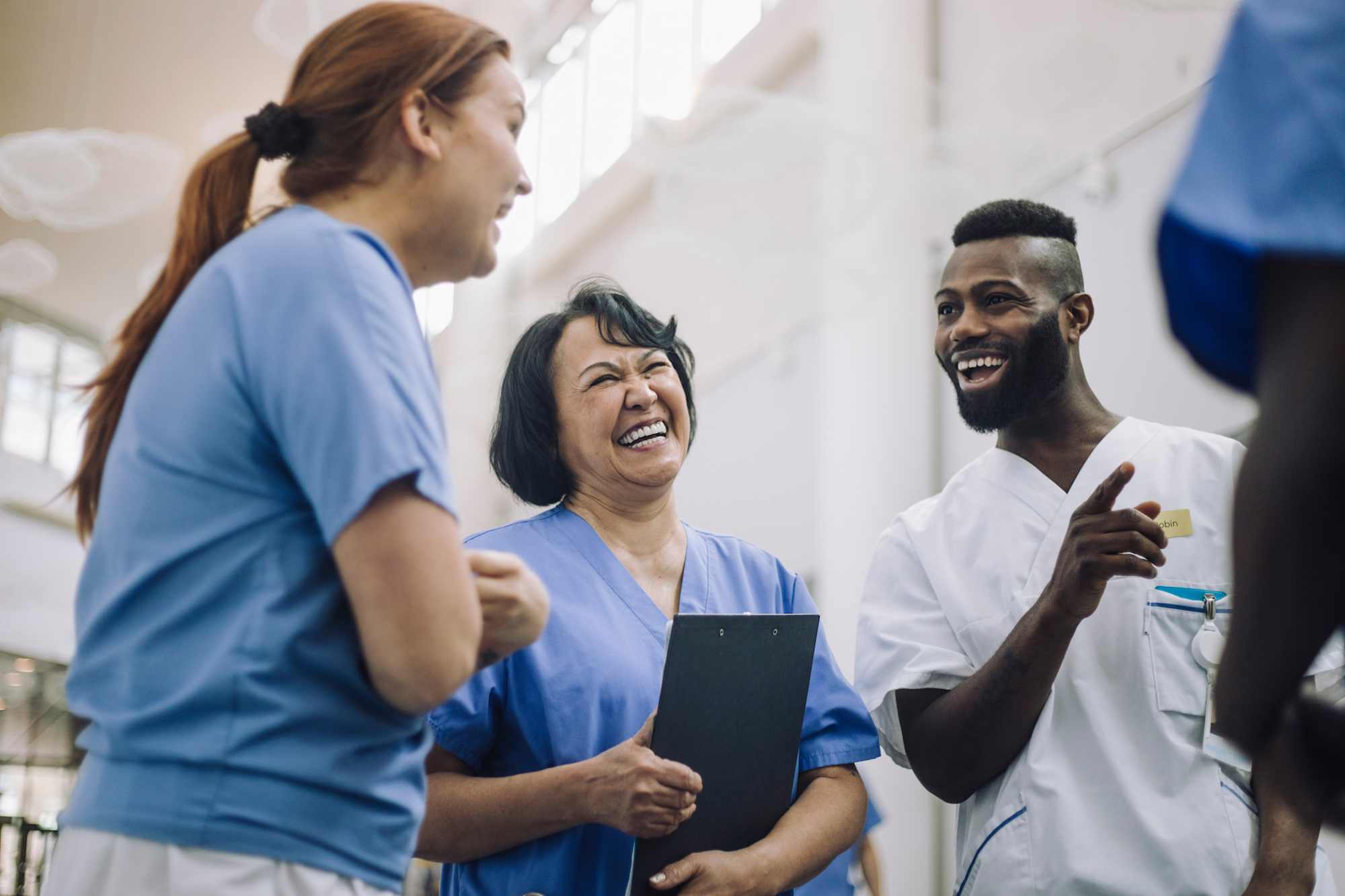 Nurses meeting and laughing together