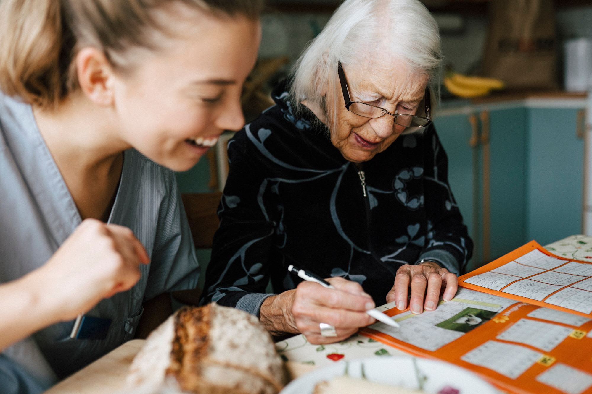 Social worker helping elderly pateitn