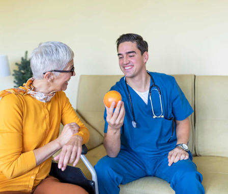 Nutrition nurse helping senior patient