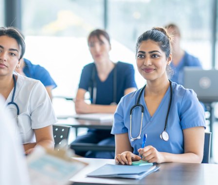 Nursing students listening in a class lecture