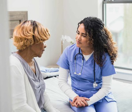 Psychiatric nurse talking to patient