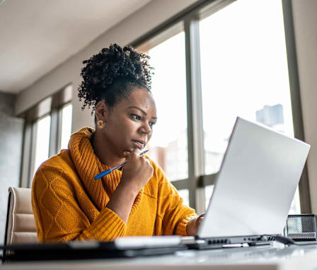 Woman taking test on laptop