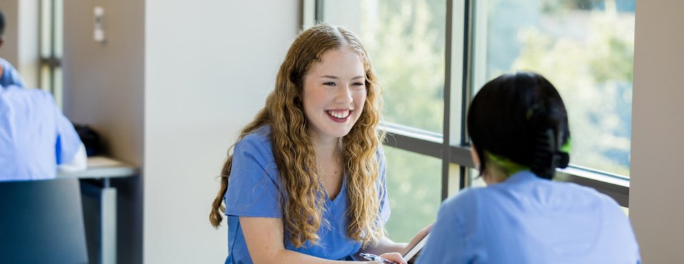 Nursing students studying notes together