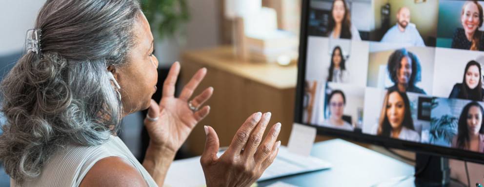 Woman on work video call in home office