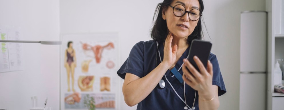 Nurse educator making video on smartphone