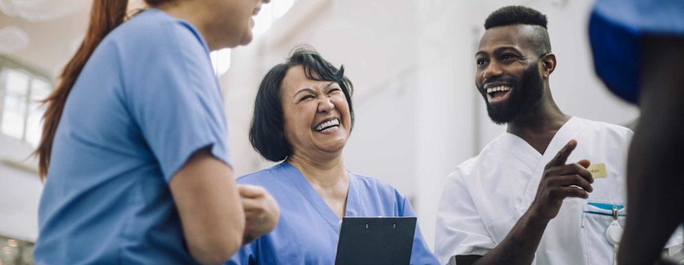Nurses meeting and laughing together