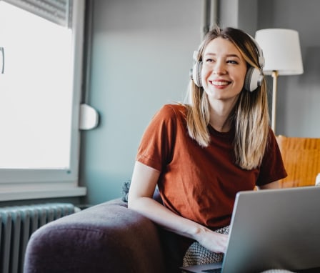 woman smiling on laptop
